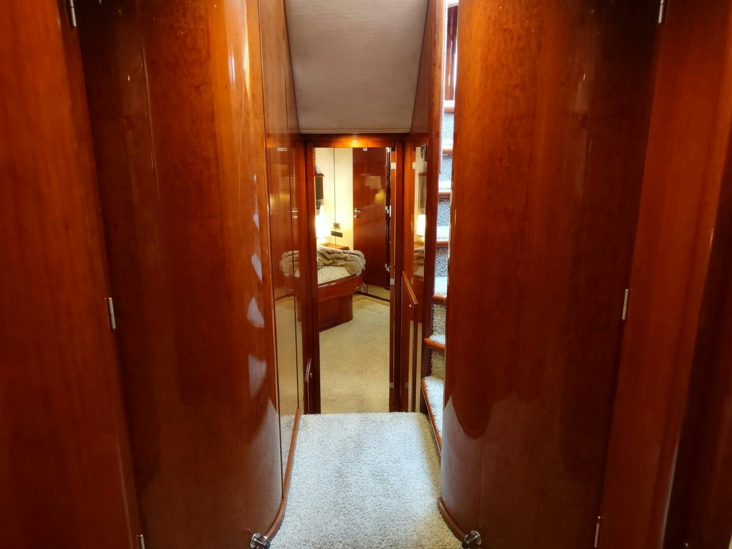 a hallway with wood walls aboard F66 Yacht for Sale