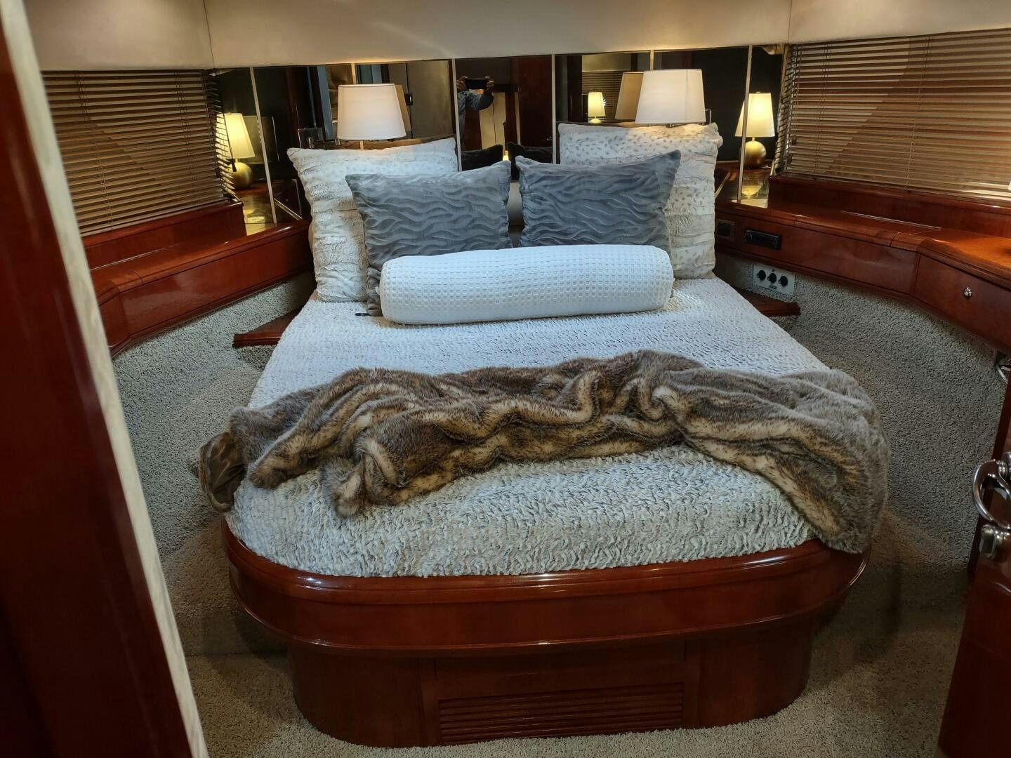 a bed with a large pillow aboard F66 Yacht for Sale