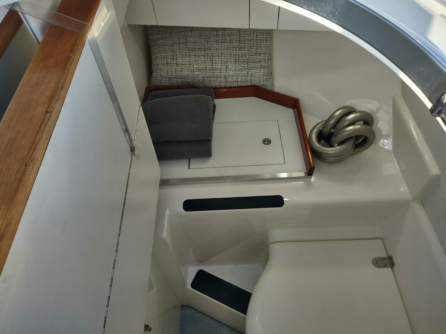 a laptop on a white counter aboard F66 Yacht for Sale