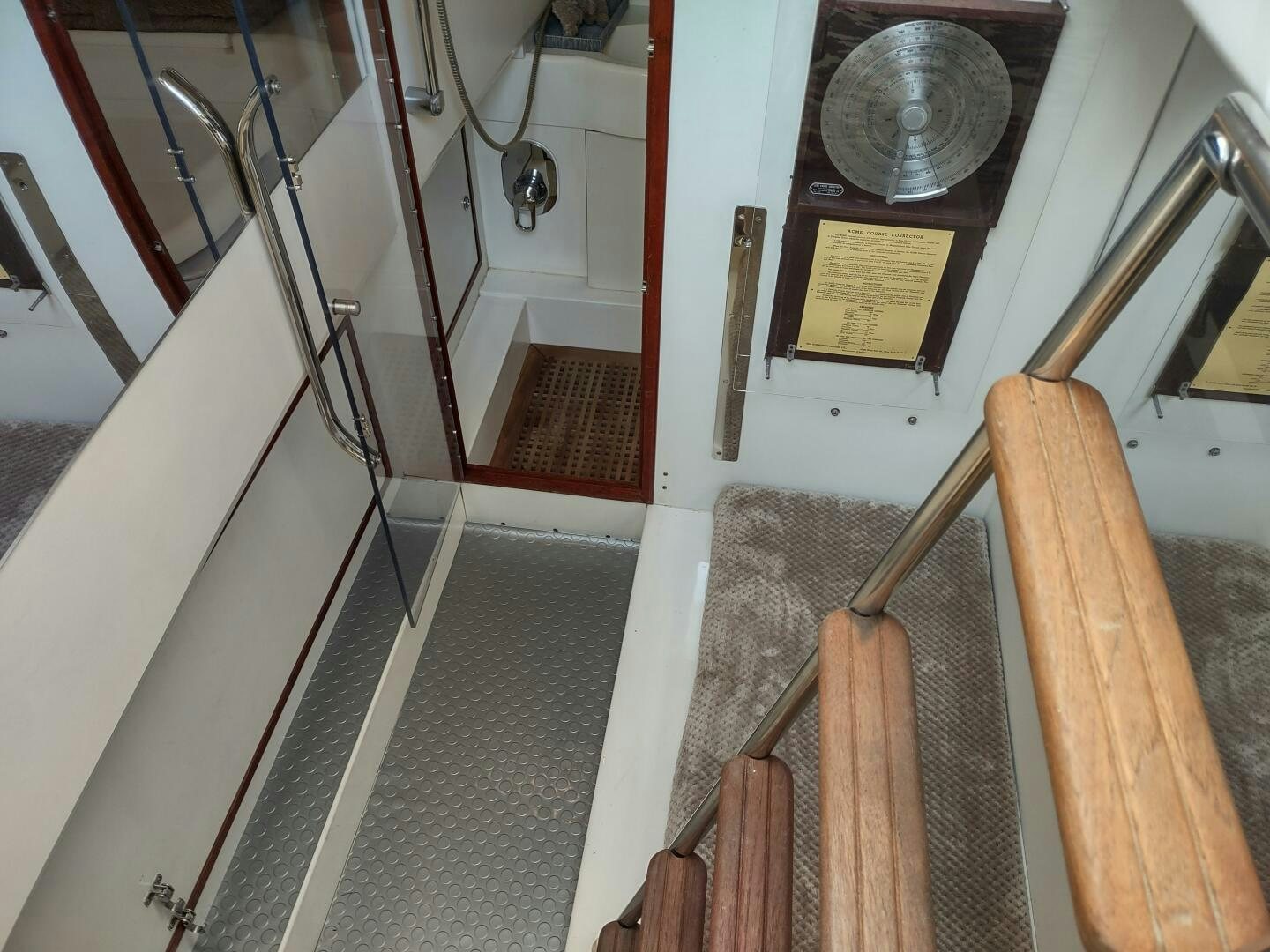 a staircase with a round metal railing aboard F66 Yacht for Sale