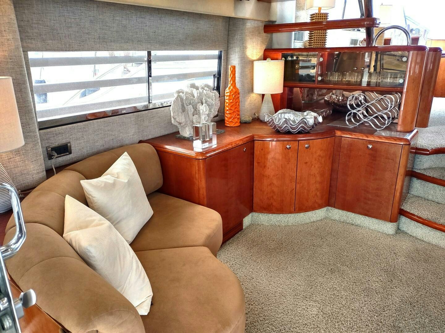 a living room with a couch and a coffee table aboard F66 Yacht for Sale