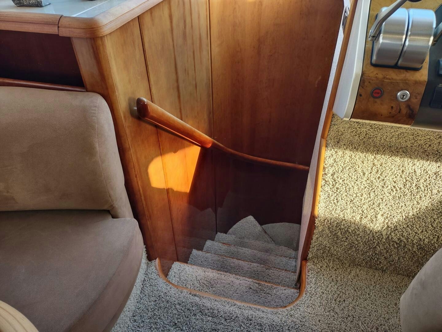 a wooden chair with a wooden seat aboard F66 Yacht for Sale