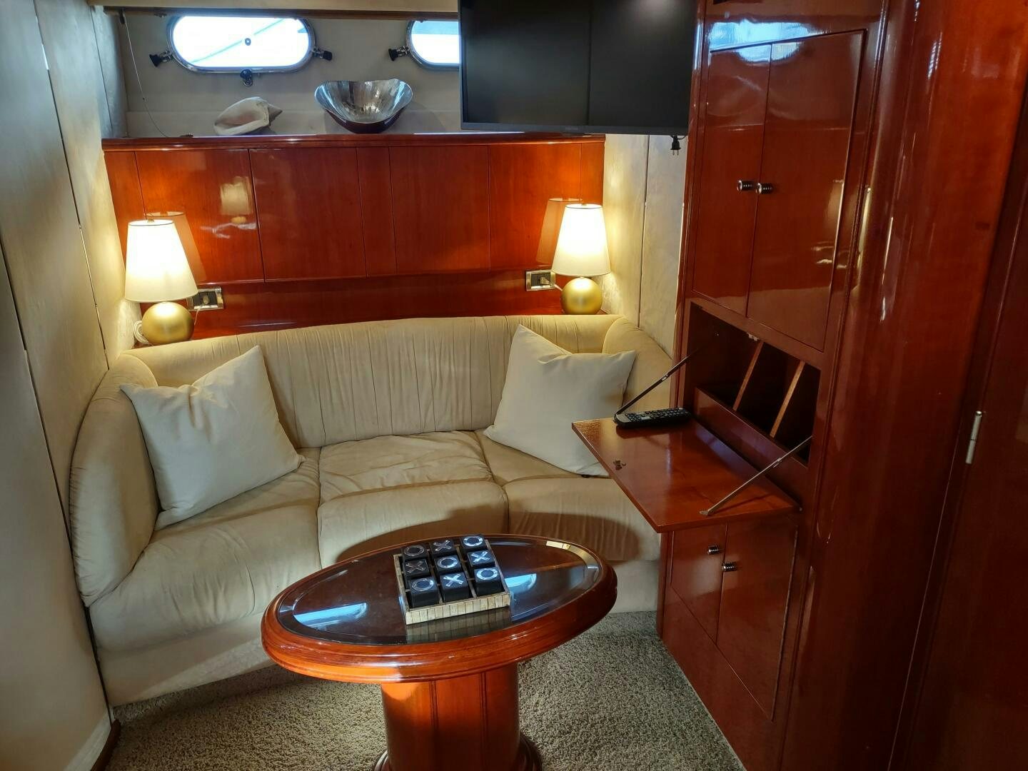 a living room with a couch and coffee table aboard F66 Yacht for Sale