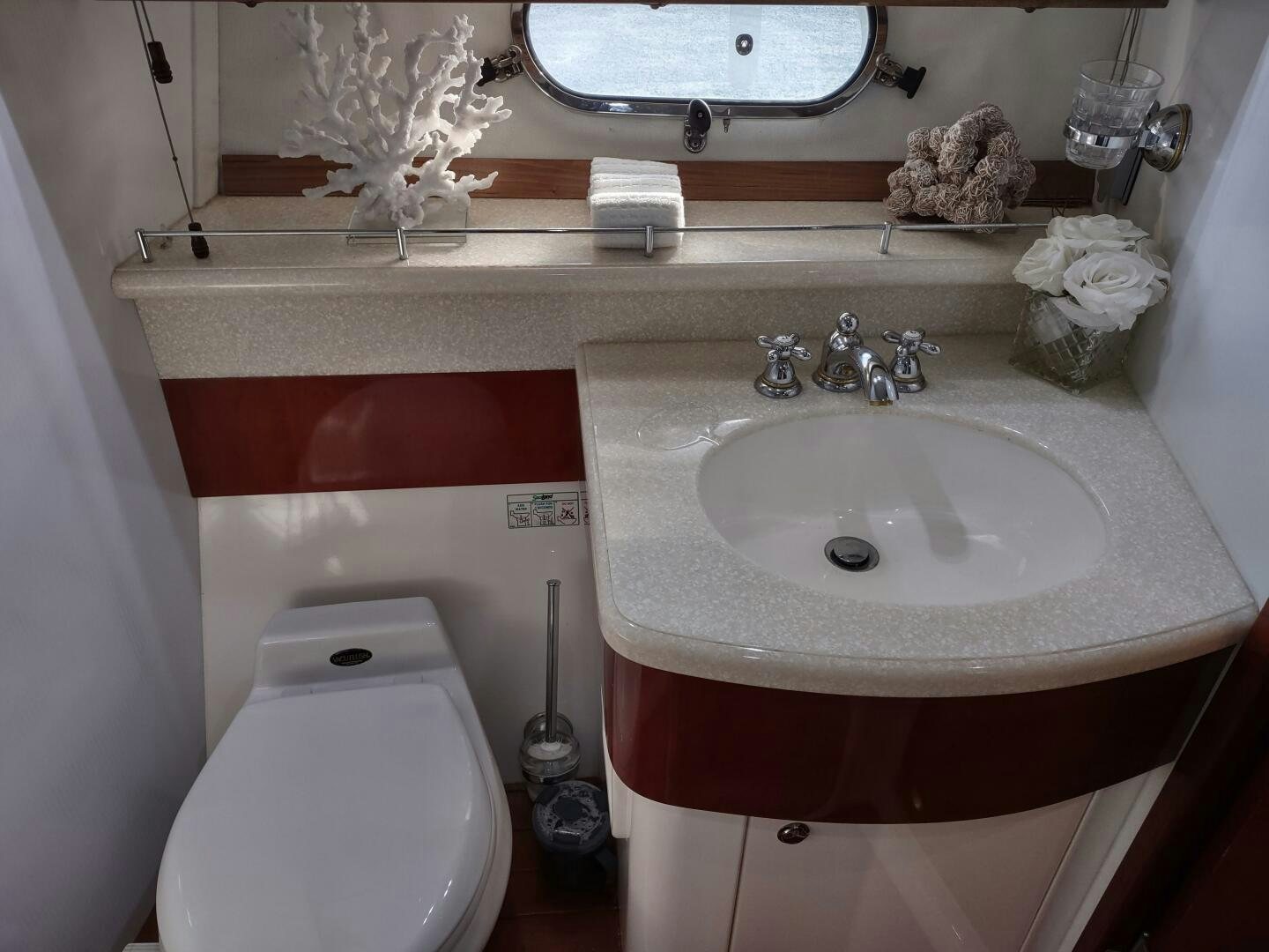 a bathroom with a sink and toilet aboard F66 Yacht for Sale