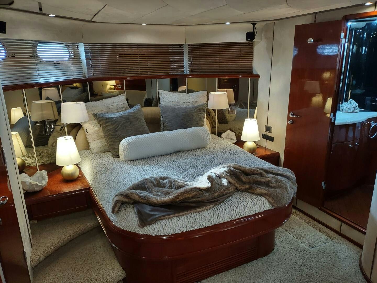 a bed with a large bed aboard F66 Yacht for Sale
