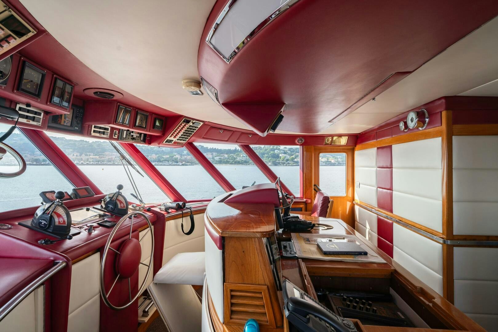 inside of a building with red and white striped walls and red trim aboard BLUEMAR II Yacht for Sale