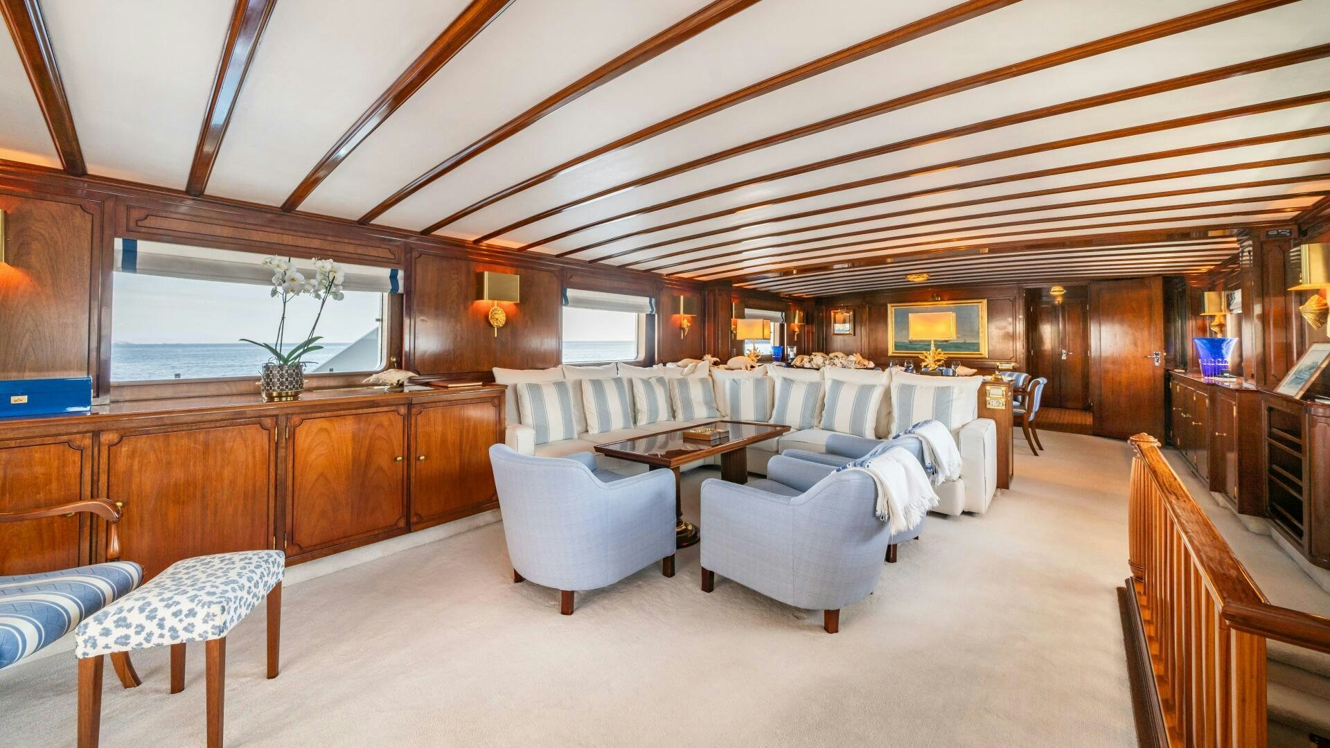 a large living room with a large wood ceiling aboard BLUEMAR II Yacht for Sale