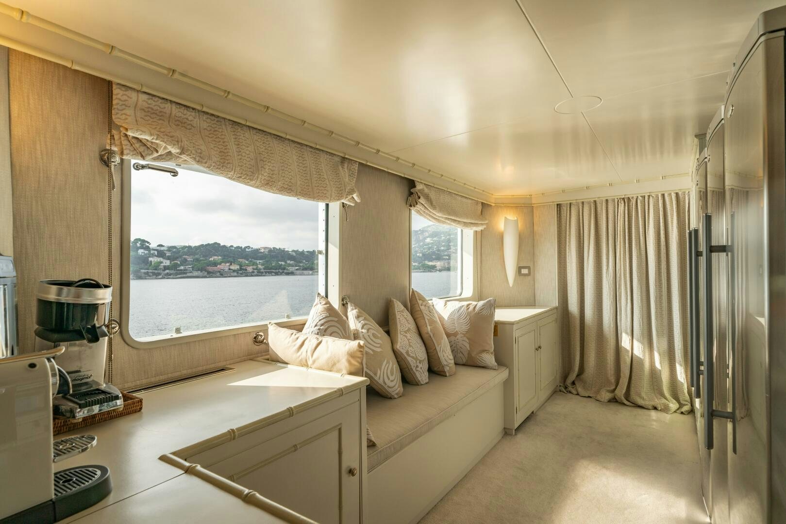 a bedroom with a bed and a window aboard BLUEMAR II Yacht for Sale