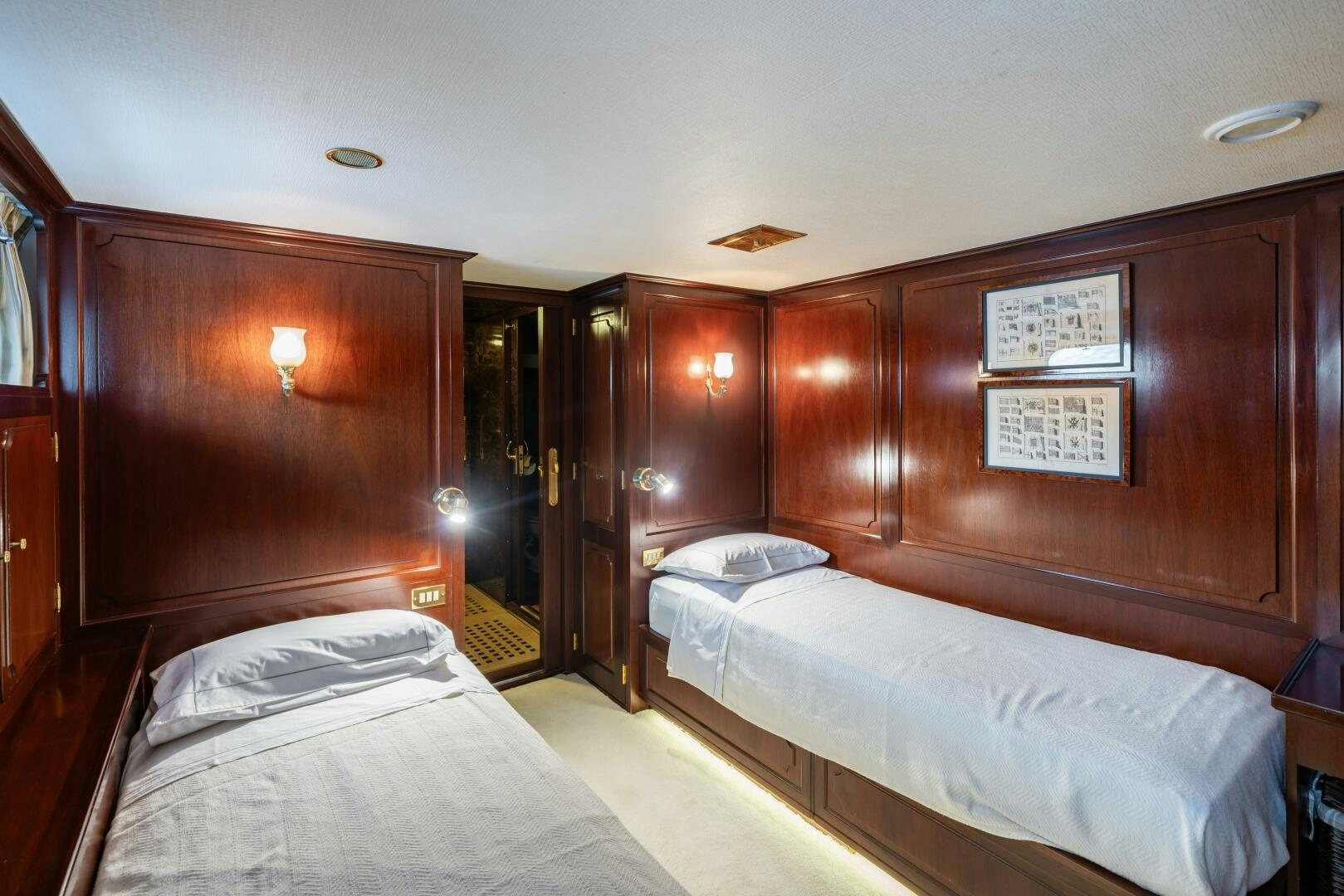 a couple of beds in a room aboard BLUEMAR II Yacht for Sale