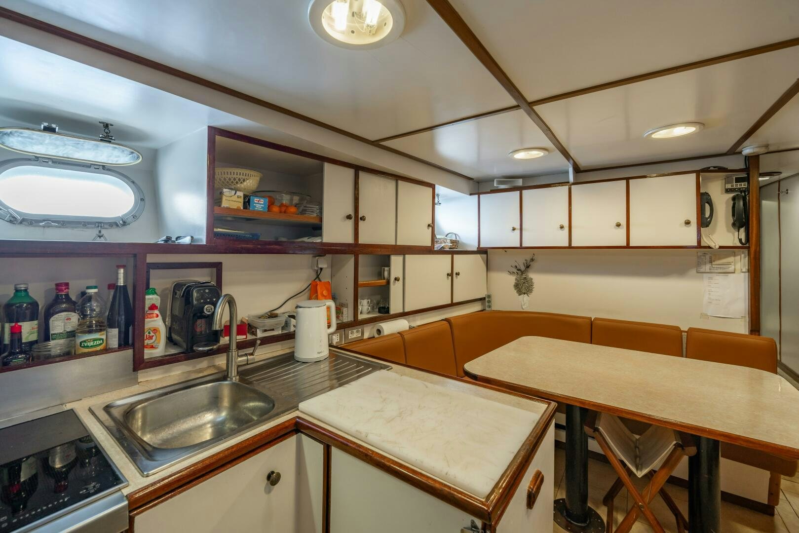a kitchen with a sink and a counter aboard BLUEMAR II Yacht for Sale