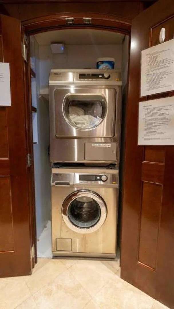 a washer and dryer in a room aboard ODIN Yacht for Sale