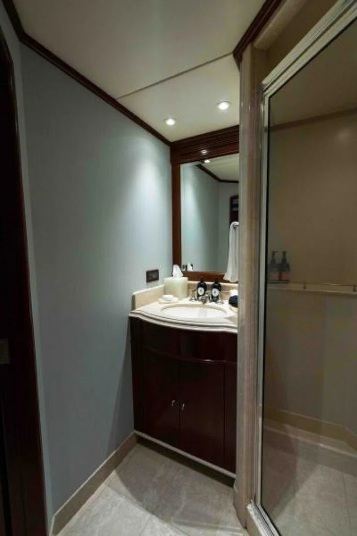 a bathroom with a sink and a mirror aboard ODIN Yacht for Sale