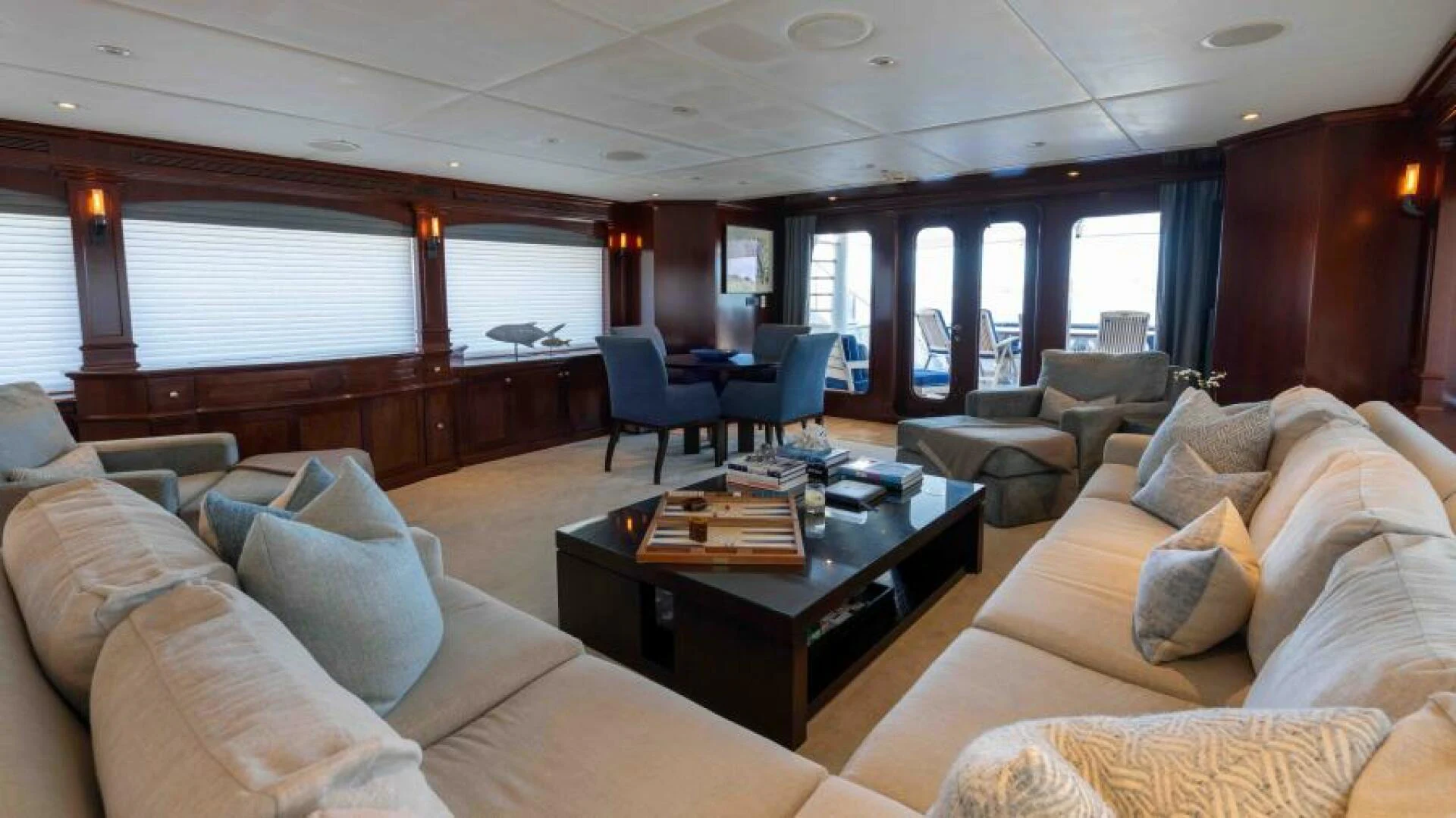 a living room with a couch and a coffee table aboard ODIN Yacht for Sale