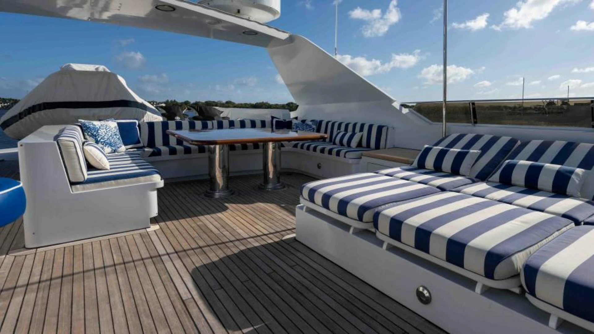 a deck with beds and a pool aboard ODIN Yacht for Sale