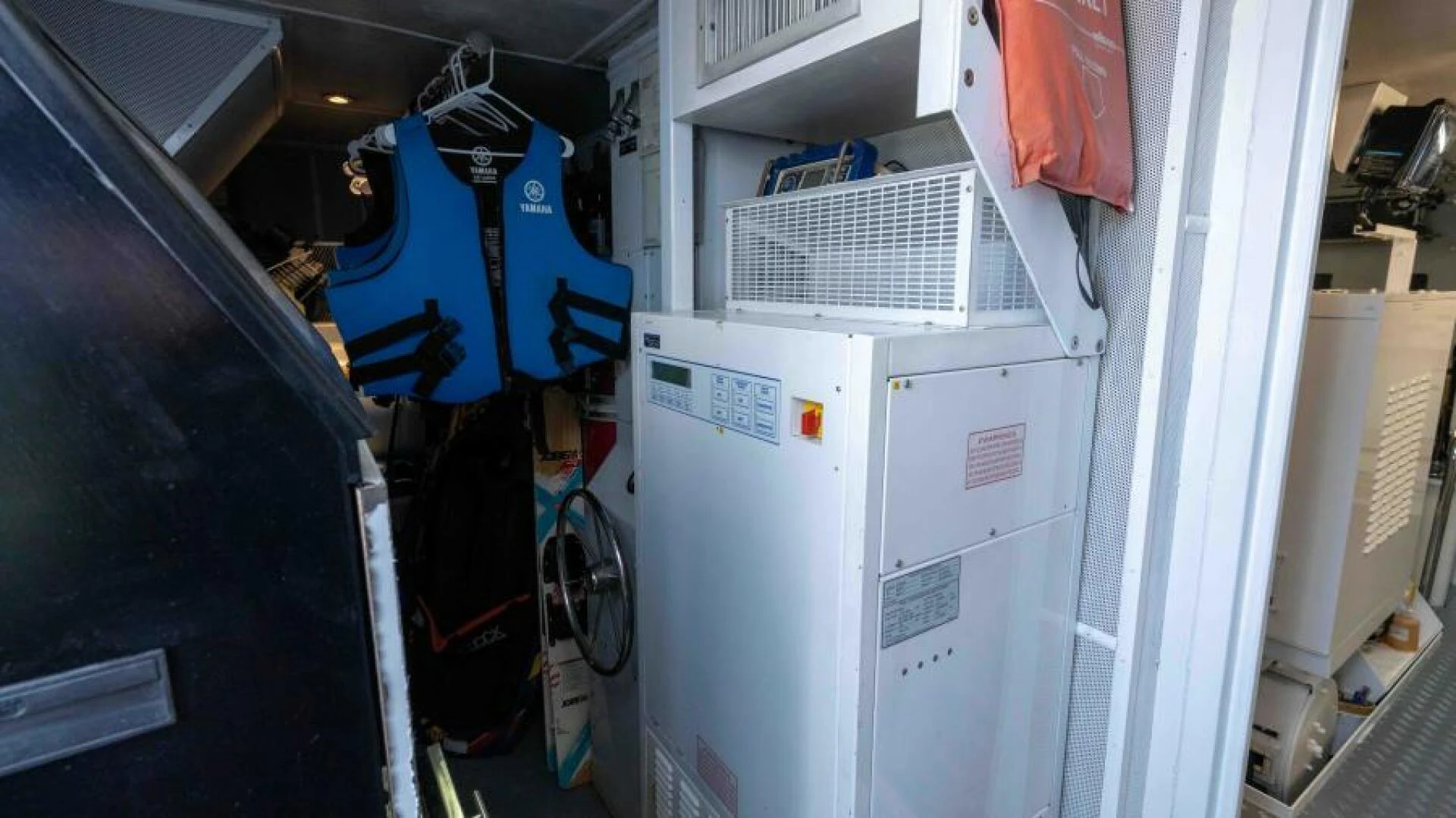 a large white machine with a blue bag on the back aboard ODIN Yacht for Sale