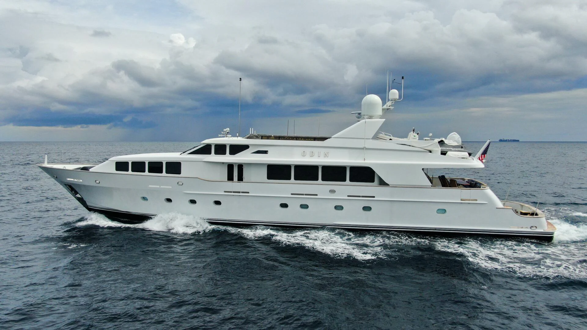a white yacht in the water aboard ODIN Yacht for Sale