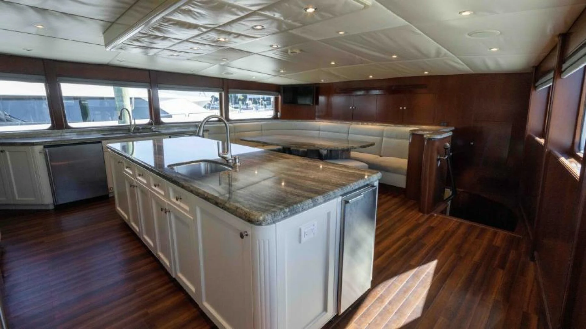 a kitchen with a large island aboard ODIN Yacht for Sale
