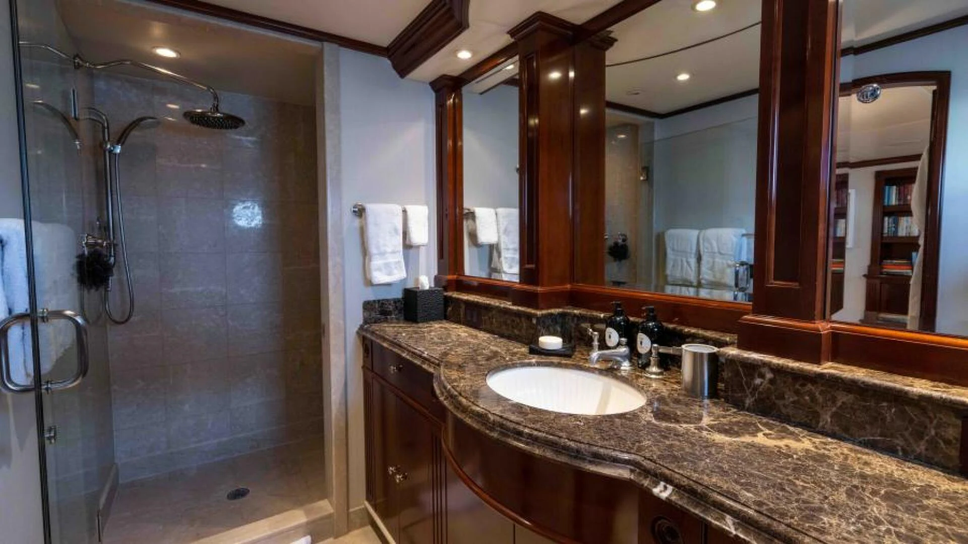 a bathroom with a large marble countertop aboard ODIN Yacht for Sale