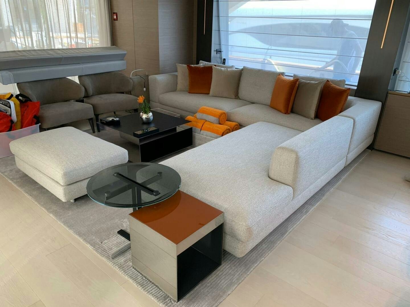 a living room with a couch and a coffee table aboard MARIA THERESA Yacht for Sale