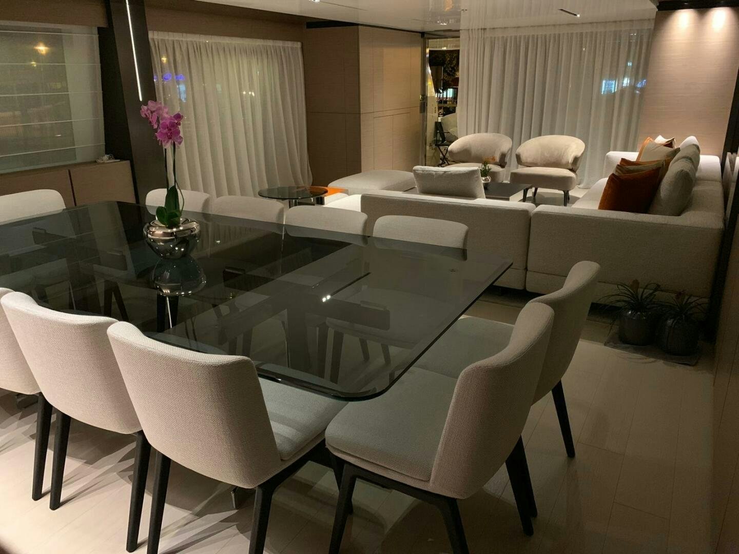 a large room with a table and chairs aboard MARIA THERESA Yacht for Sale