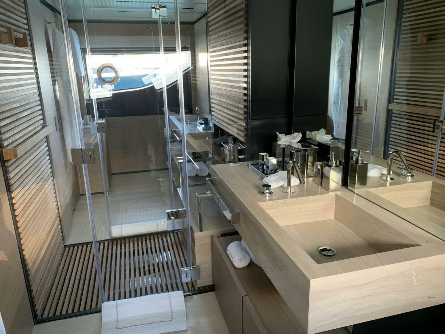 a bathroom with a countertop sink and a mirror aboard MARIA THERESA Yacht for Sale