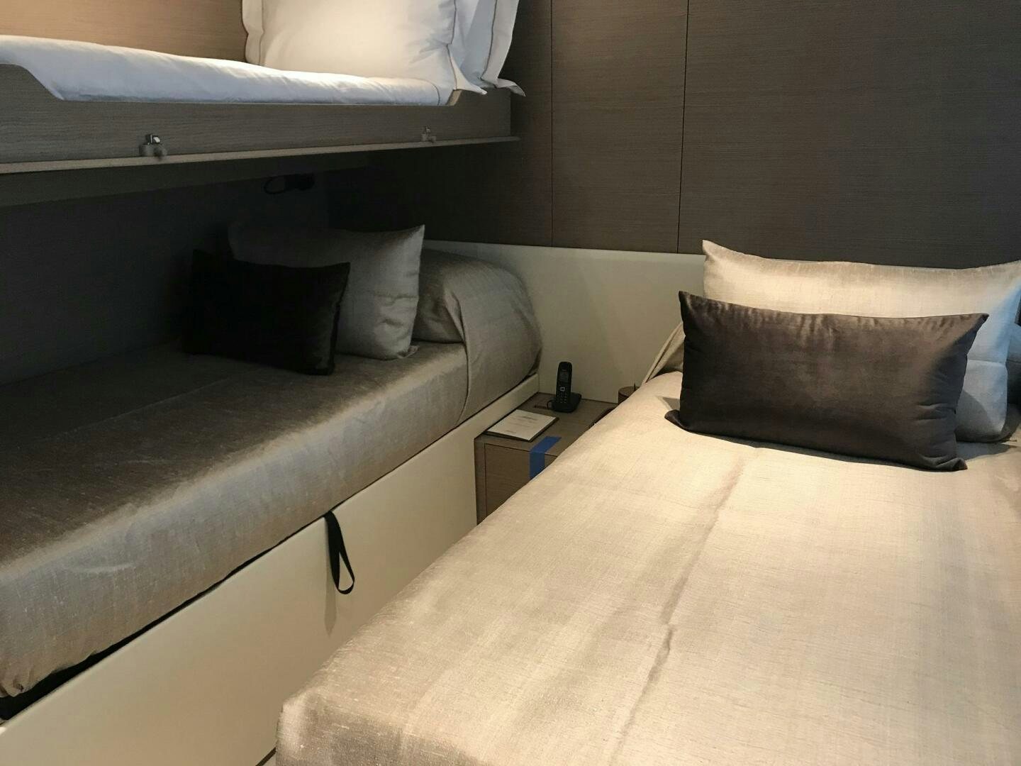 a bed with pillows aboard MARIA THERESA Yacht for Sale