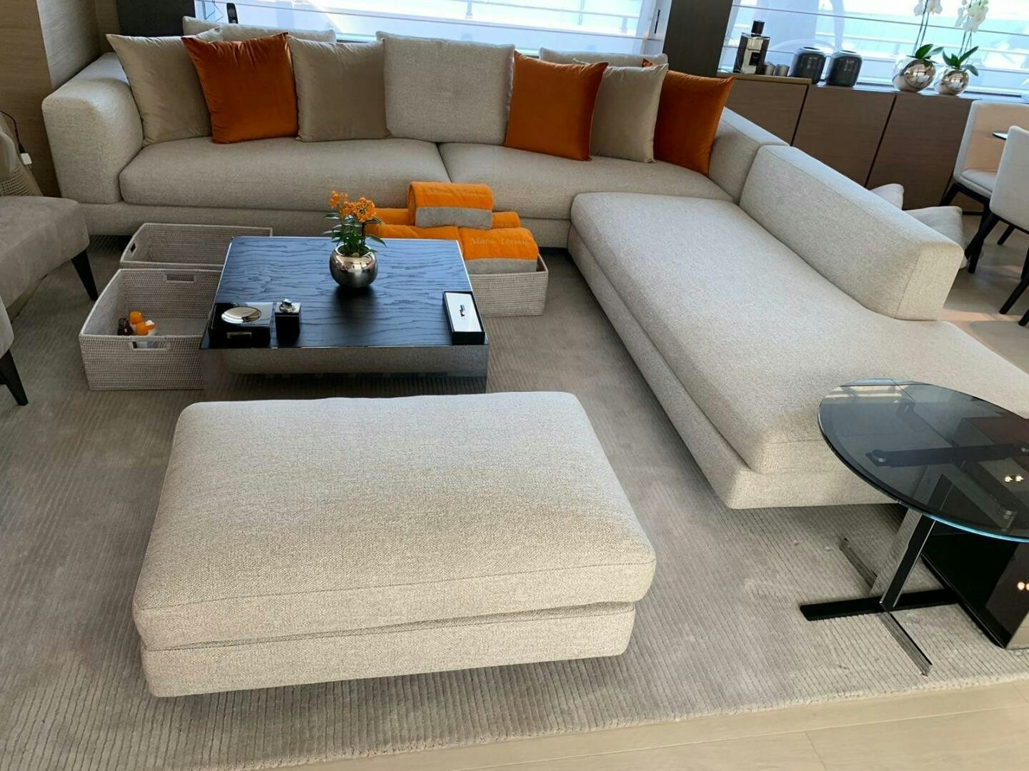 a living room with a couch and coffee table aboard MARIA THERESA Yacht for Sale