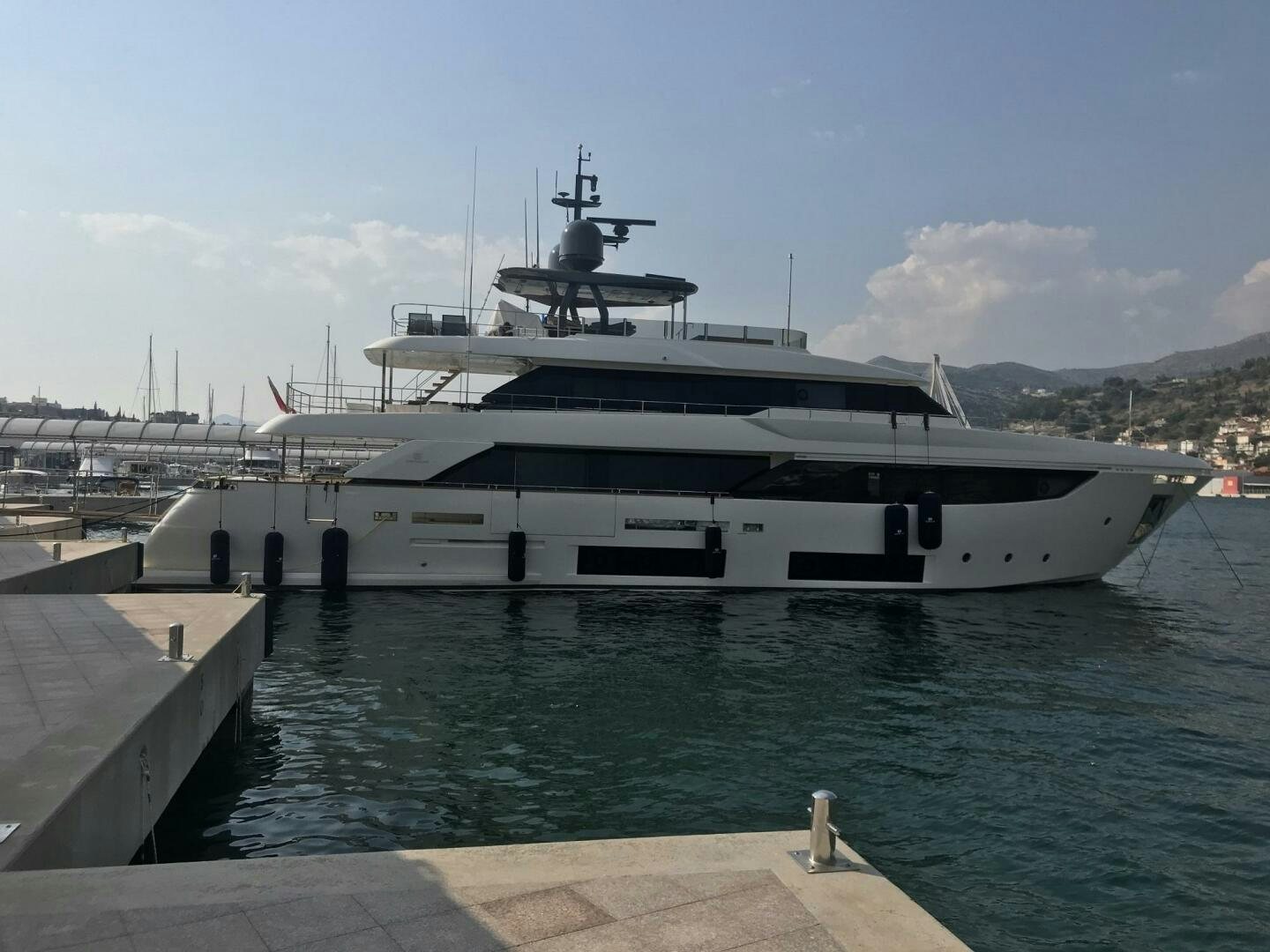 a large white yacht docked at a dock aboard MARIA THERESA Yacht for Sale