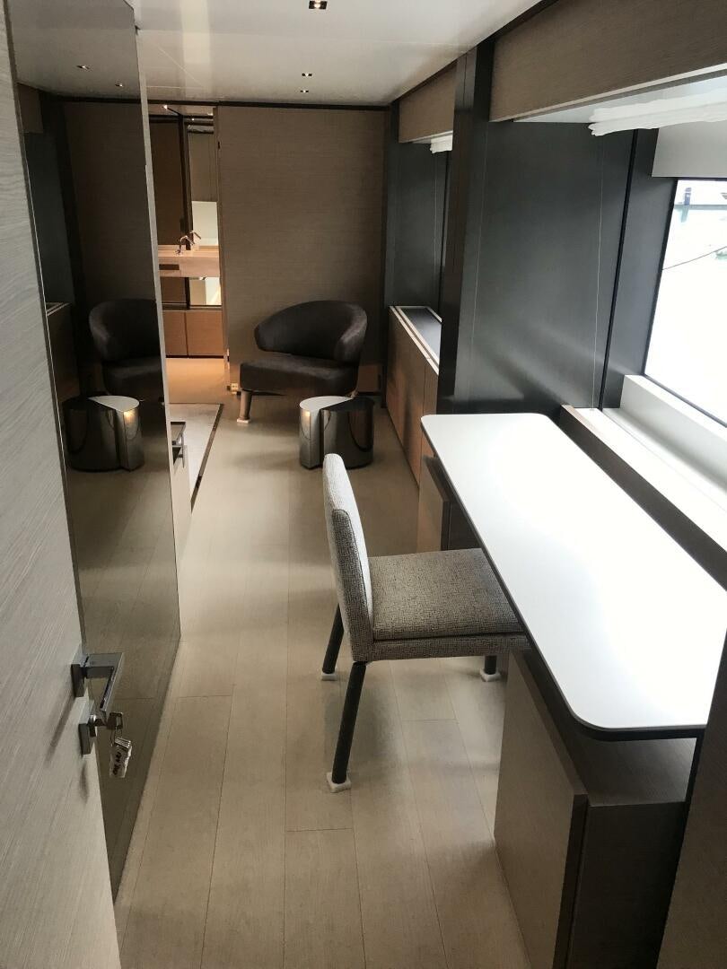 a room with a chair and desk aboard MARIA THERESA Yacht for Sale