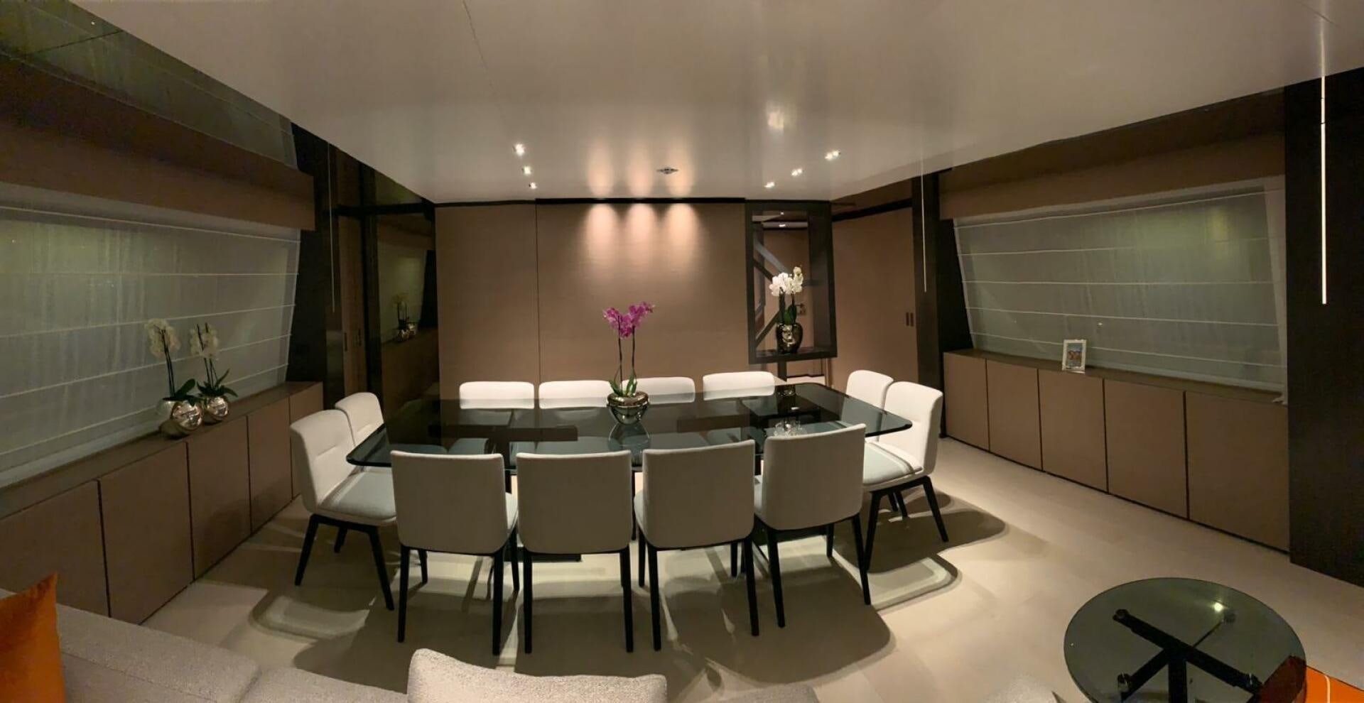 a room with a table chairs and a window aboard MARIA THERESA Yacht for Sale