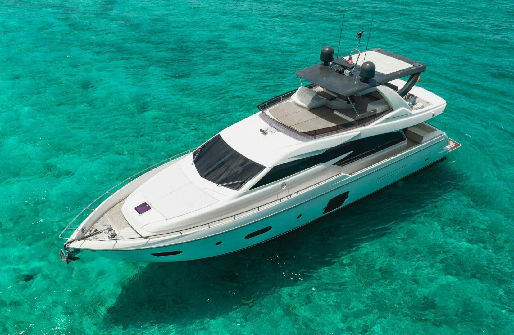 a white boat on the water aboard KUDU Yacht for Sale