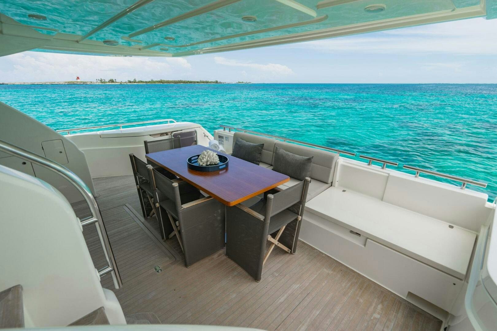 a table and chairs on a boat aboard KUDU Yacht for Sale