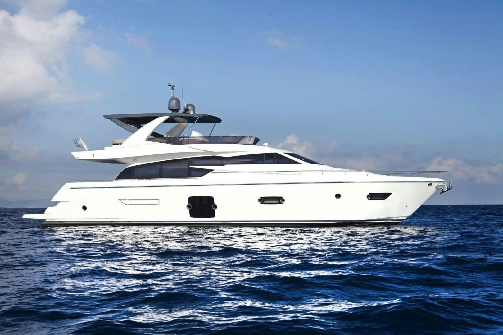 a white yacht in the water aboard KUDU Yacht for Sale