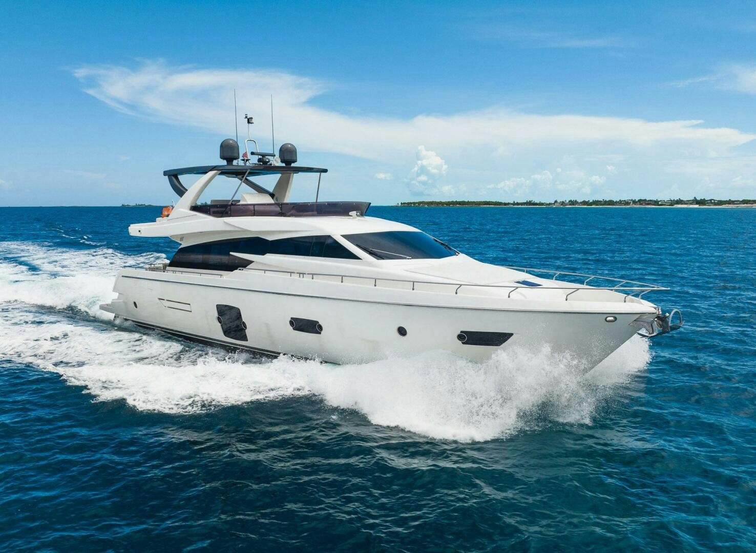 a white yacht on the water aboard KUDU Yacht for Sale