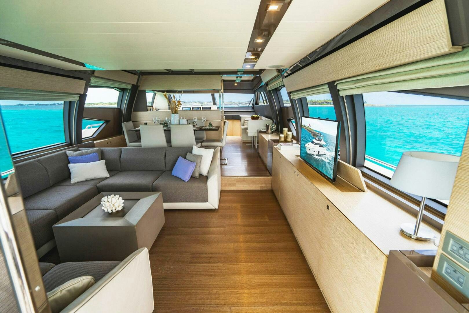 a room with a couch and a tv aboard KUDU Yacht for Sale