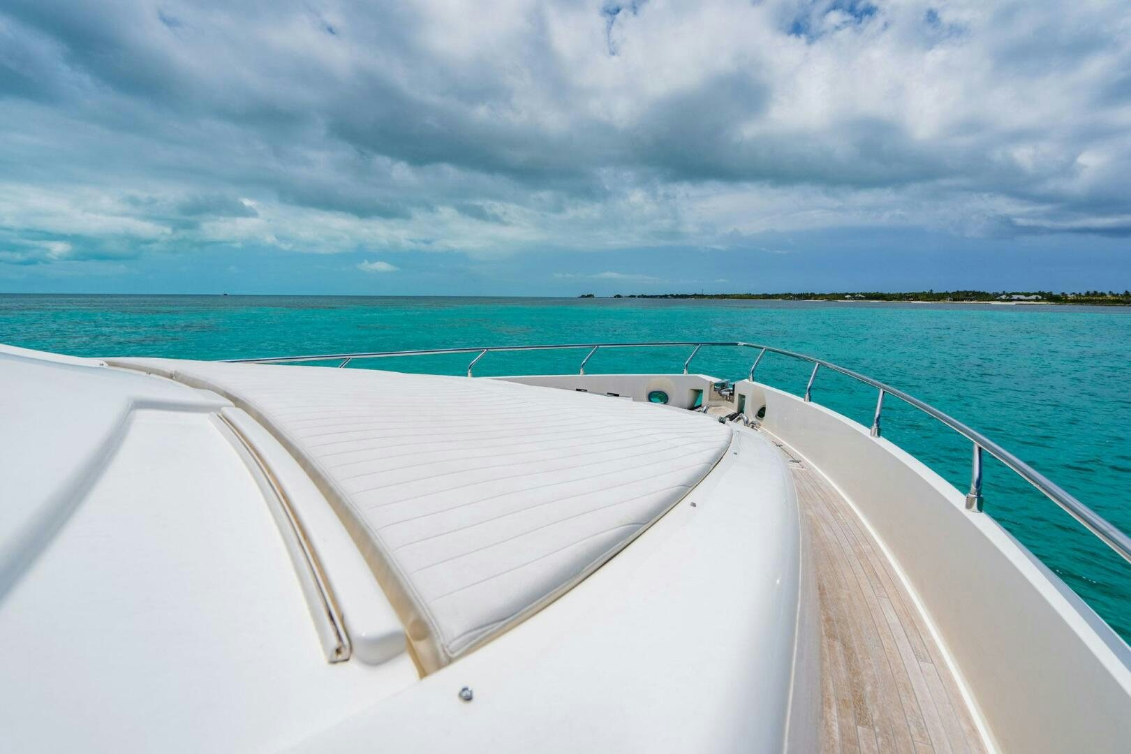 a white boat on a beach aboard KUDU Yacht for Sale
