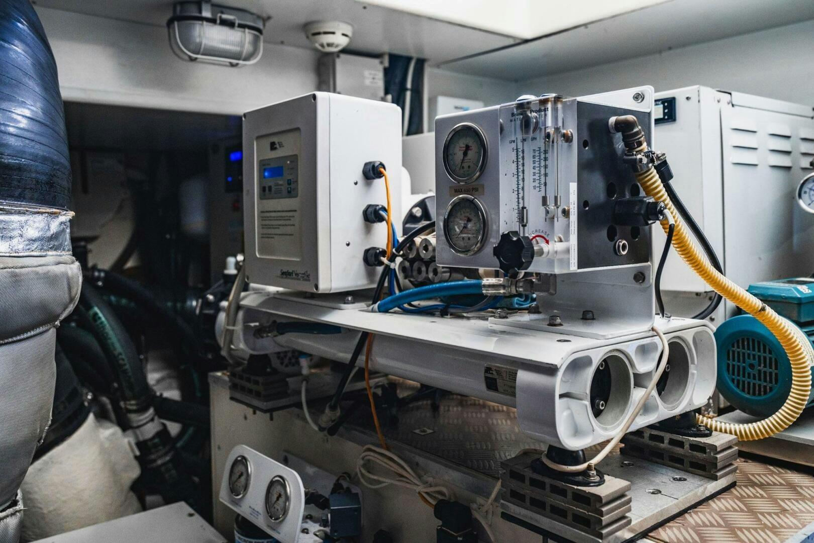 a machine with a large piece of equipment on it aboard KUDU Yacht for Sale
