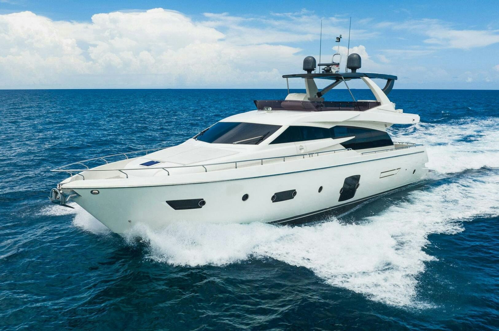 a white yacht on the water aboard KUDU Yacht for Sale