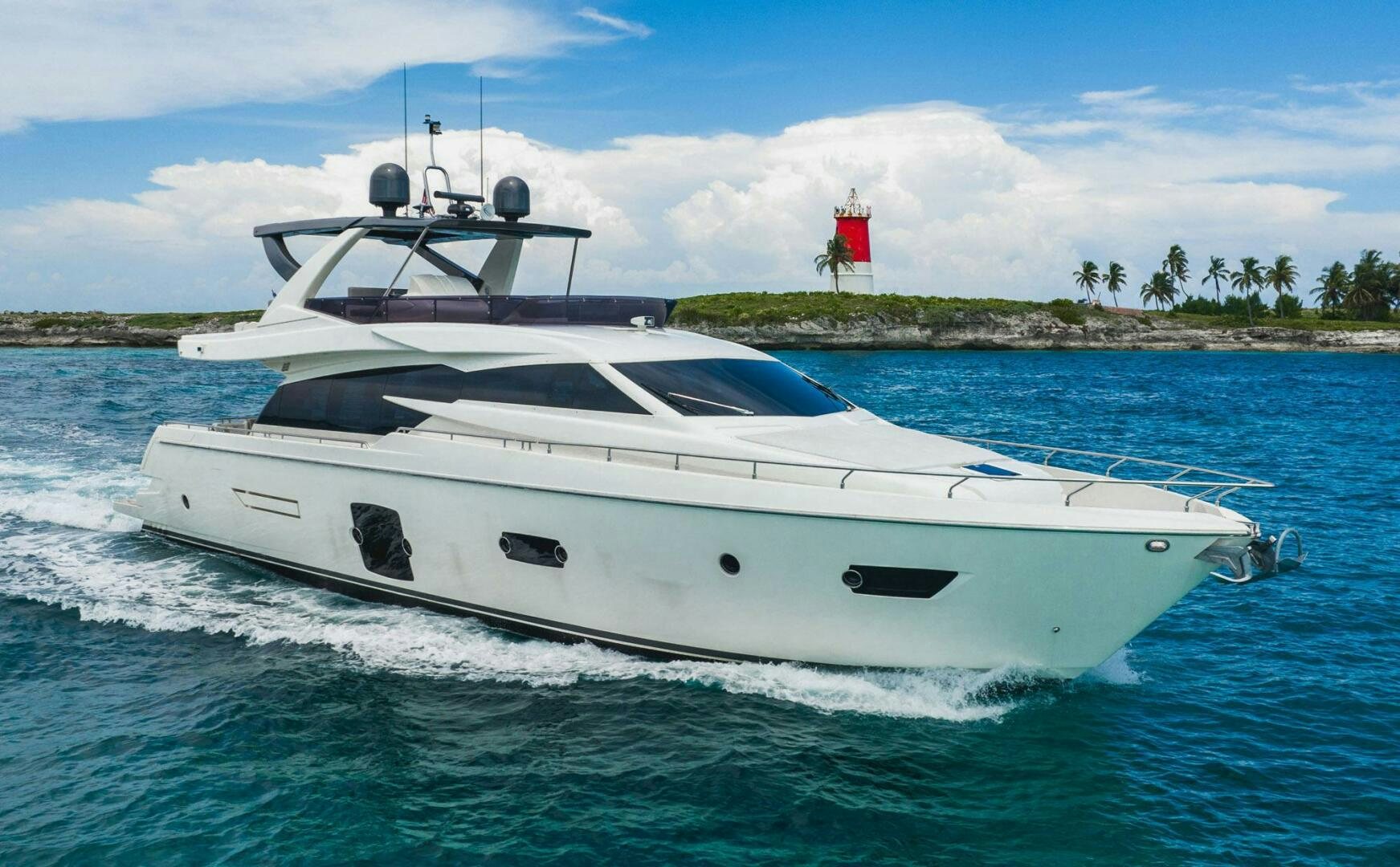 a white yacht in the water aboard KUDU Yacht for Sale