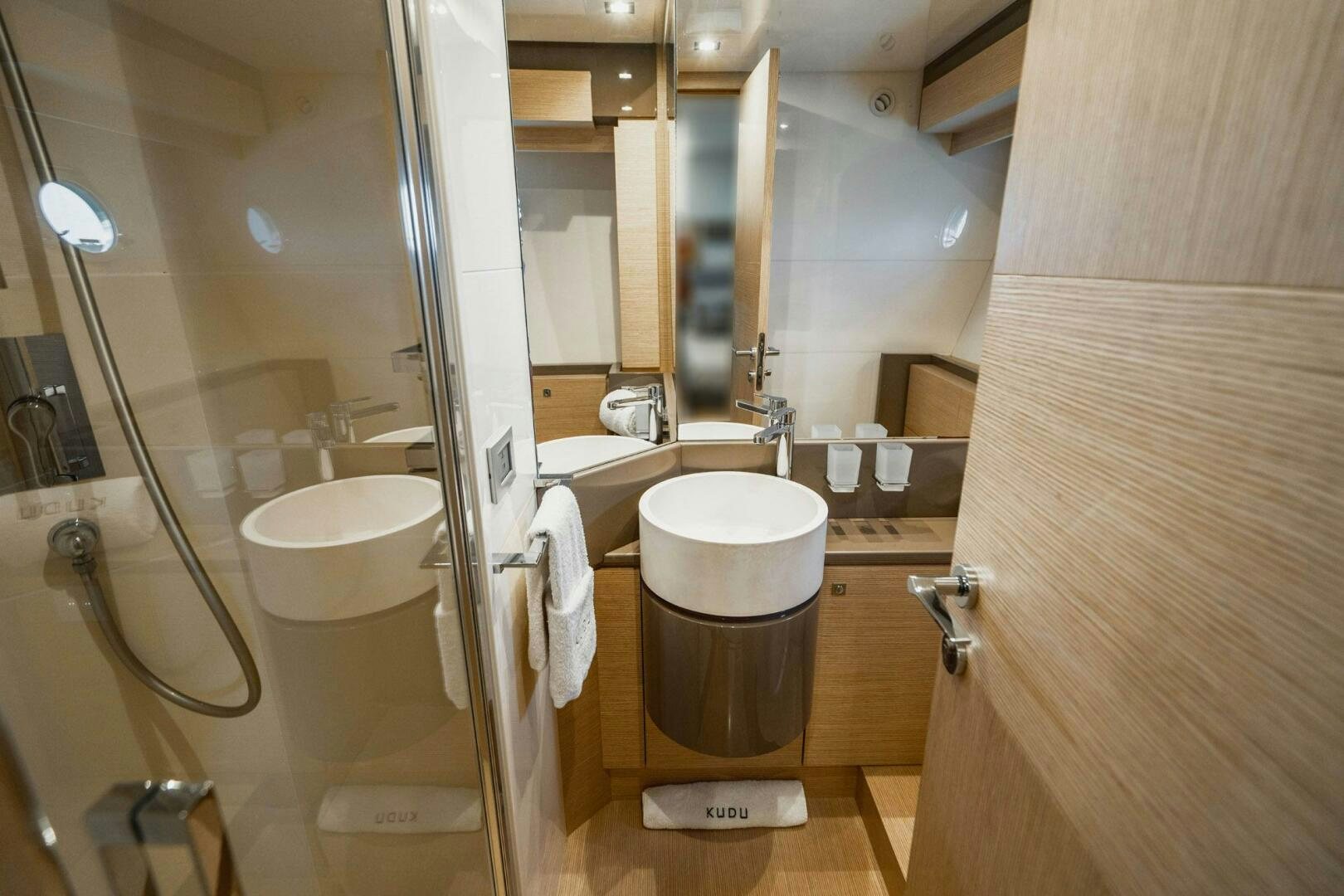 a bathroom with a toilet and a sink aboard KUDU Yacht for Sale