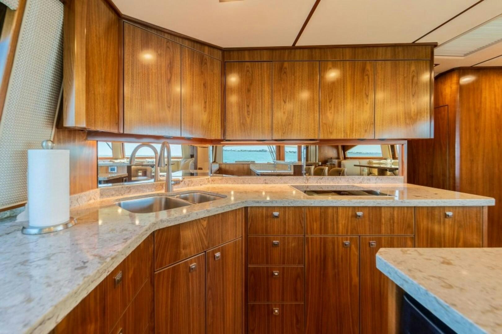 a kitchen with wooden cabinets aboard WRAPPED UP Yacht for Sale