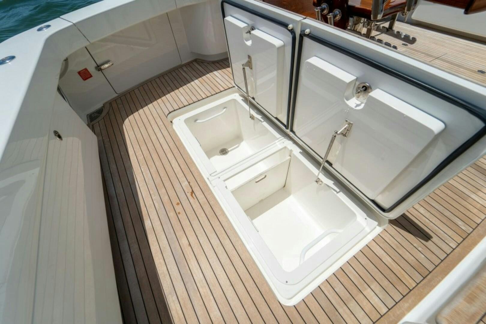 a bathroom with a sink and a bathtub aboard WRAPPED UP Yacht for Sale