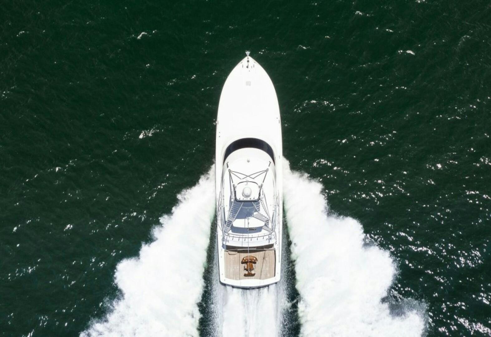 a white snowmobile on a snowy road aboard WRAPPED UP Yacht for Sale