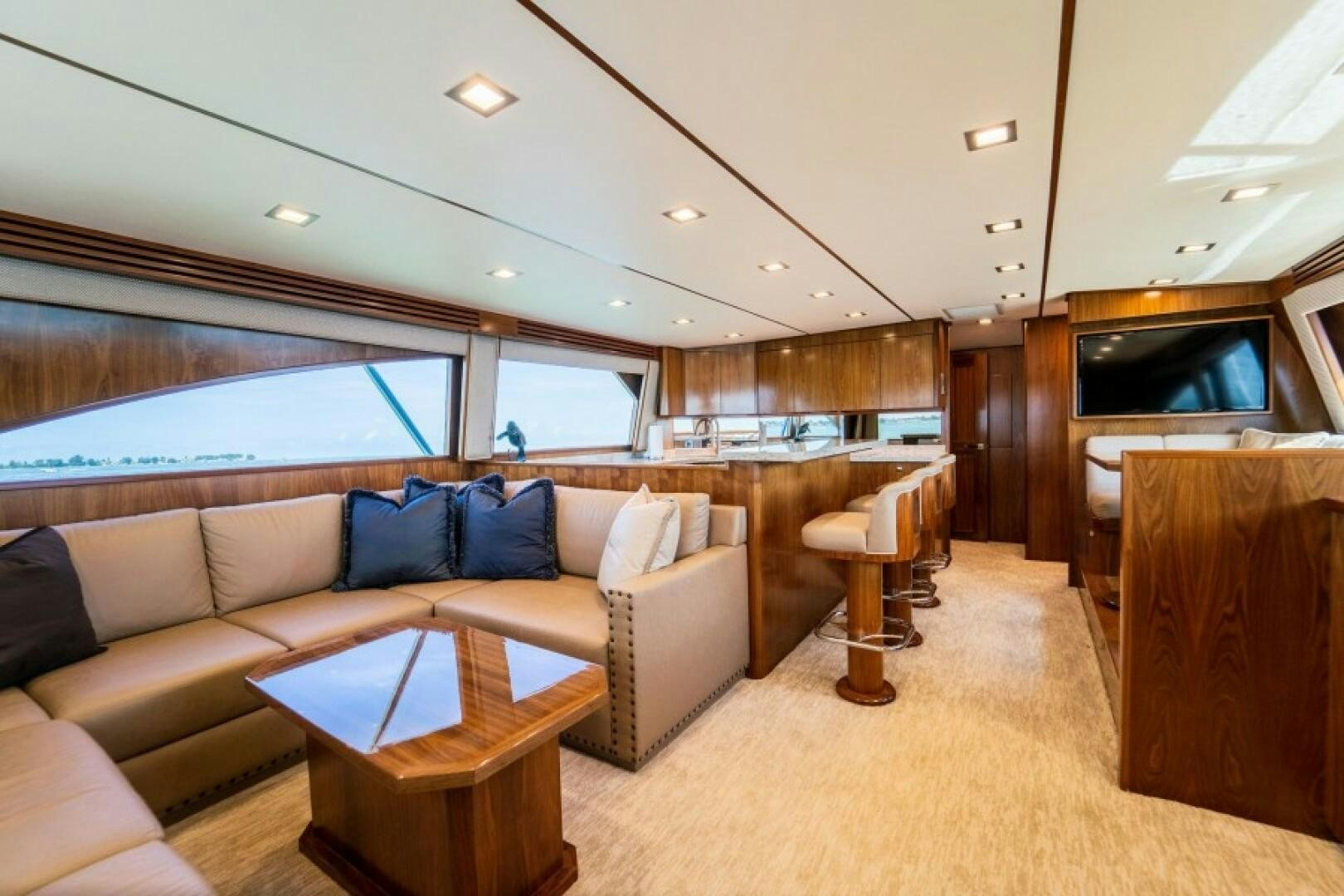 a living room with a couch and a table aboard WRAPPED UP Yacht for Sale