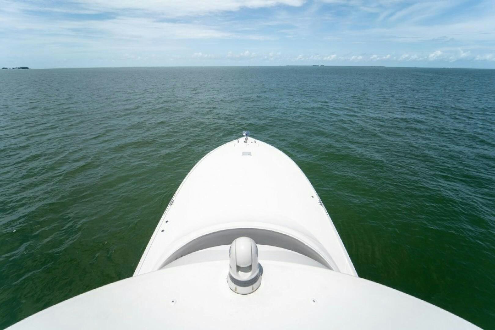 a white boat in the water aboard WRAPPED UP Yacht for Sale