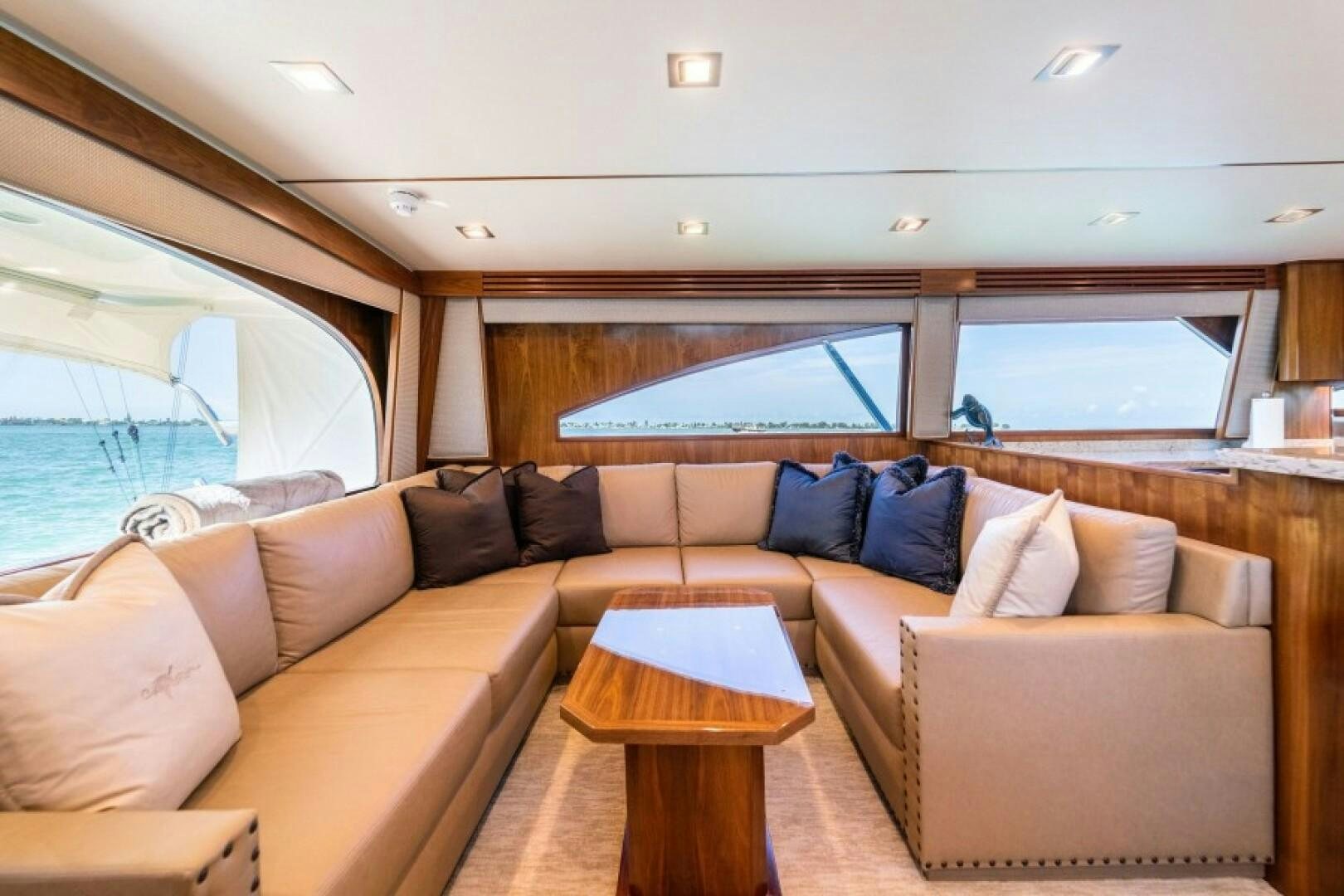 a living room with a couch and a table aboard WRAPPED UP Yacht for Sale