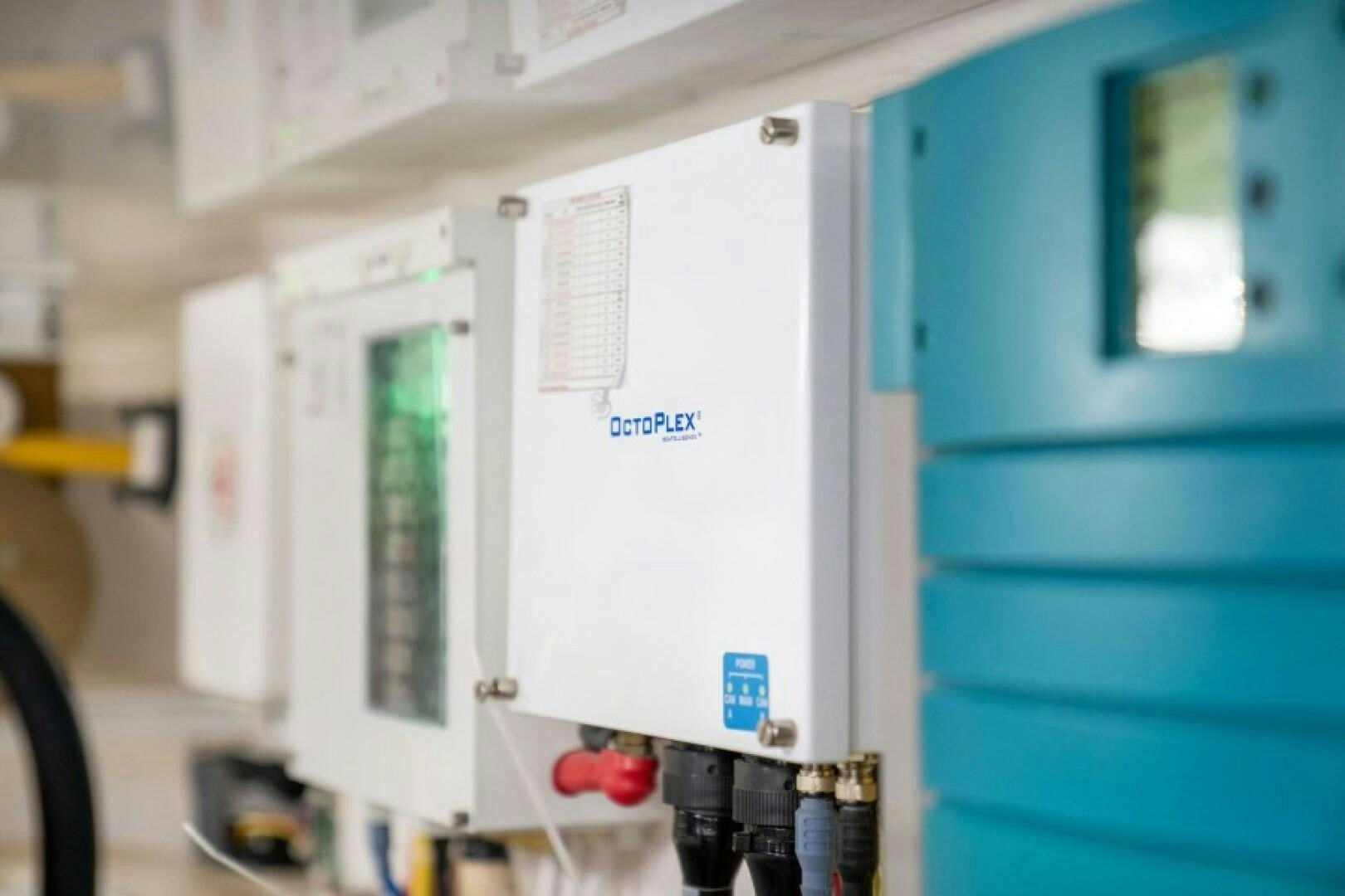 a white machine with a screen aboard WRAPPED UP Yacht for Sale