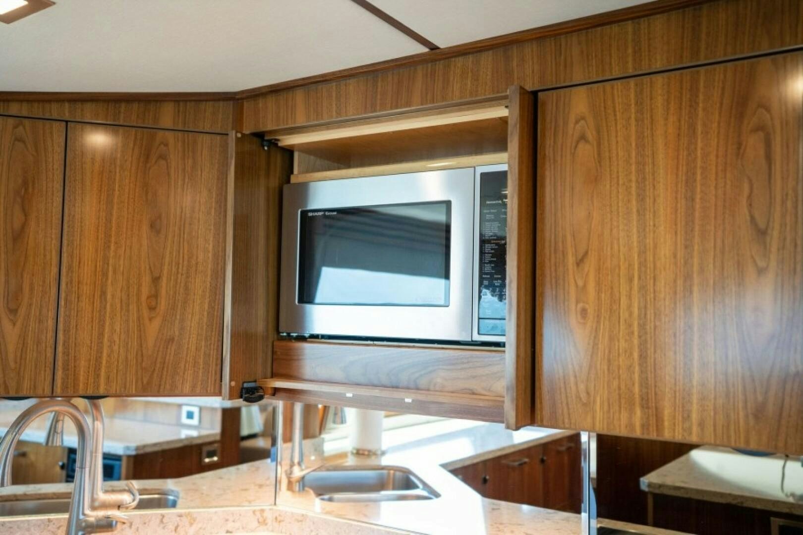 a microwave oven sits on top of a microwave oven aboard WRAPPED UP Yacht for Sale