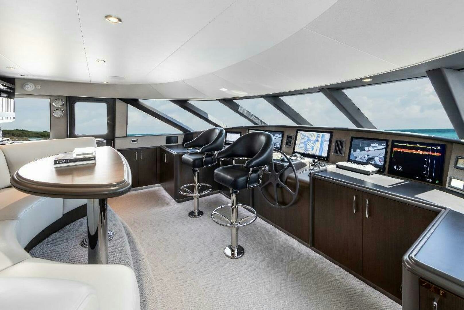 a room with a table and chairs aboard MEMENTO VIVERE Yacht for Sale