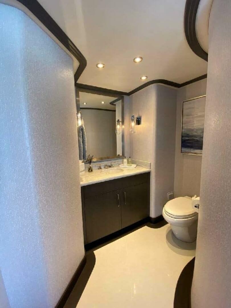 a bathroom with a sink and a toilet aboard MEMENTO VIVERE Yacht for Sale